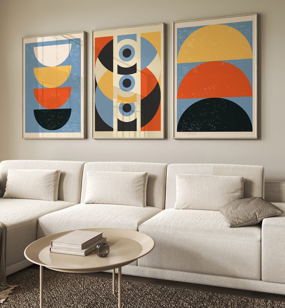 Stunning GEOMETRIC MODERN ABSTRACT, SET OF 3 PAINTINGS enhancing a stylish living room with vibrant colors and shapes.