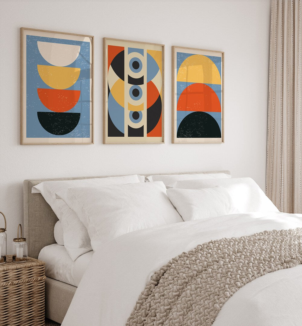 Stylish GEOMETRIC MODERN ABSTRACT, SET OF 3 PAINTINGS enhancing a chic bedroom decor with vibrant colors and shapes.