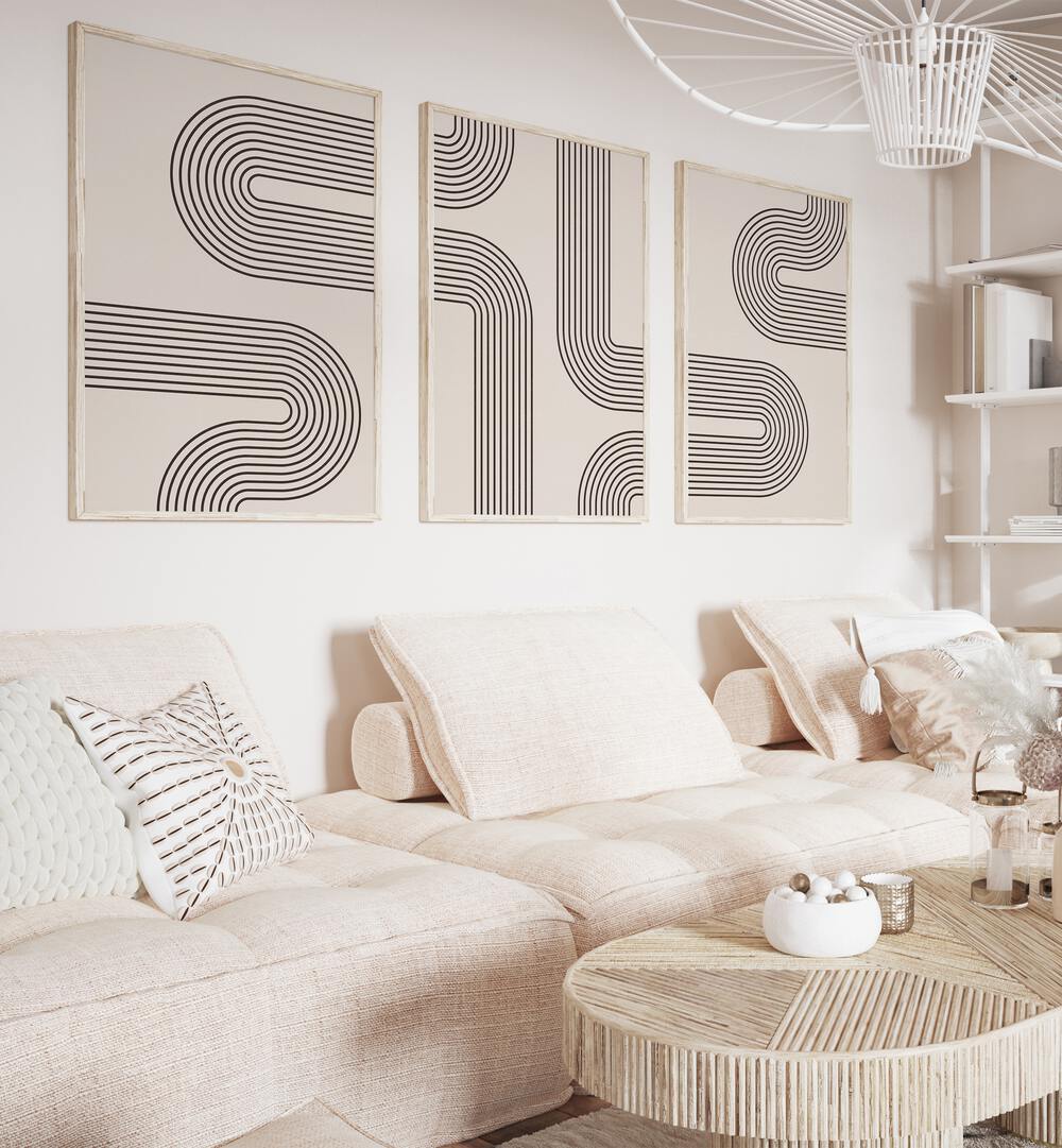 Stylish living room featuring GEOMETRICAL LINES BOHO STYLE, SET OF 3 PAINTINGS, enhancing modern decor.