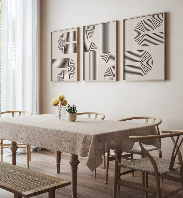 Stylish GEOMETRICAL LINES BOHO STYLE, SET OF 3 PAINTINGS enhancing a modern dining area with abstract designs.