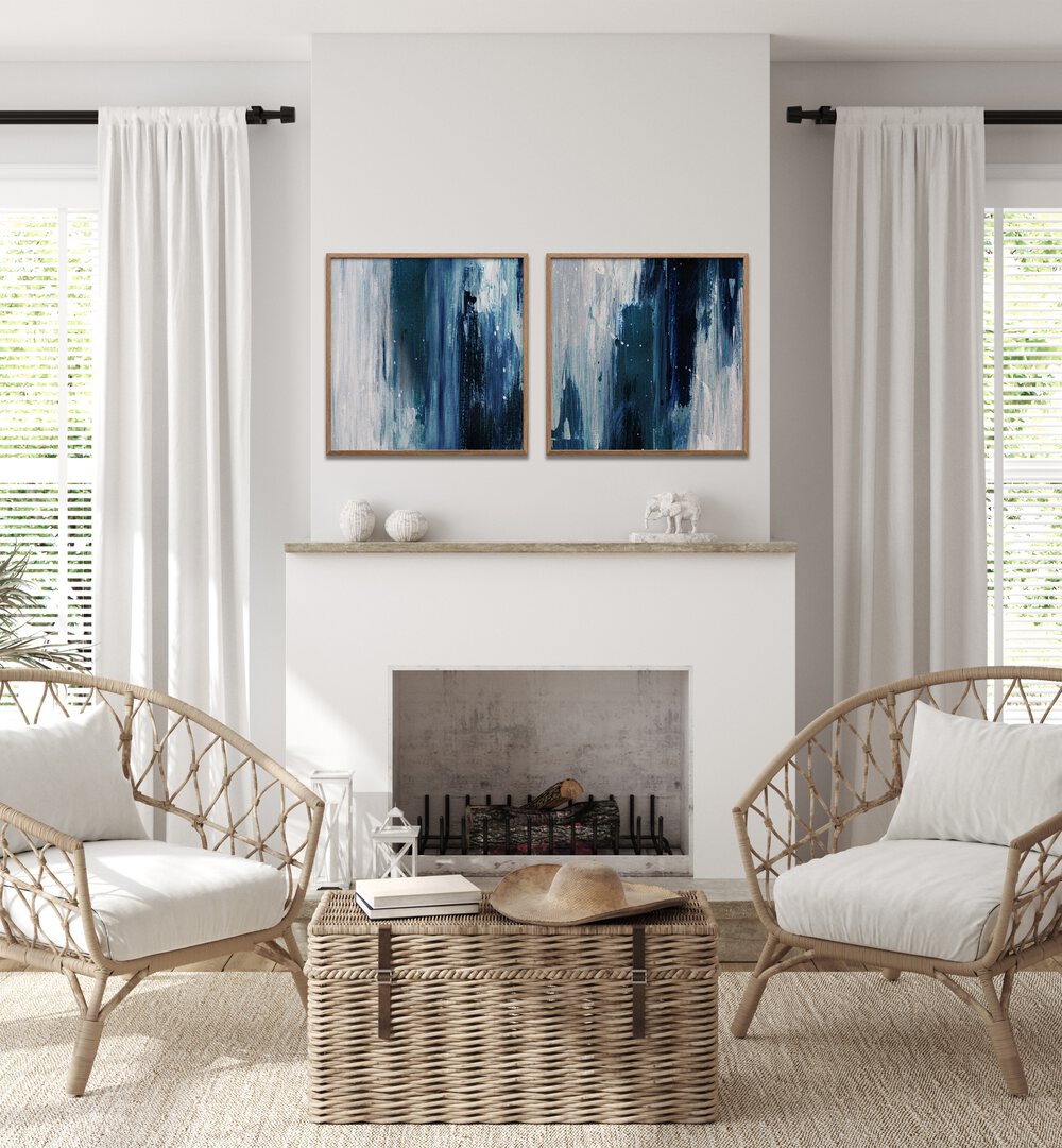 Stylish living room featuring the INDIGO SET, SET OF 2 PAINTINGS in deep blue and gray tones for a serene ambiance.