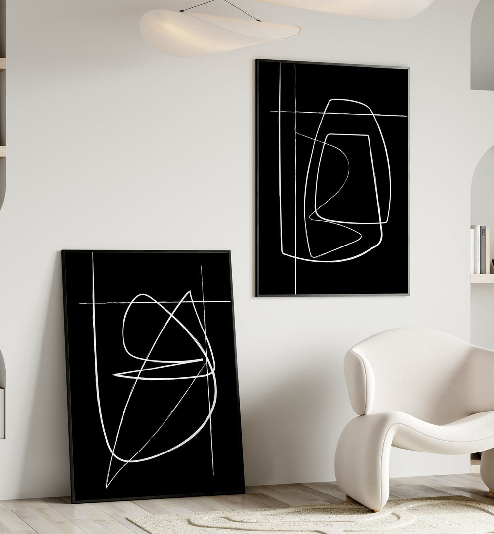 Elevate your decor with the INVERTED ABSTRACTION SET, SET OF 2 PAINTINGS featuring bold black-and-white designs.