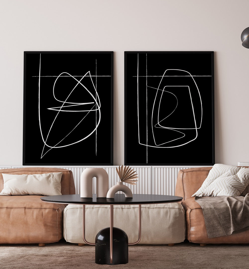Transform your space with the INVERTED ABSTRACTION SET, SET OF 2 PAINTINGS featuring bold black-and-white designs.