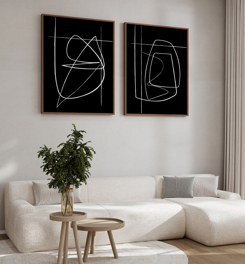 Transform your space with the INVERTED ABSTRACTION SET, SET OF 2 PAINTINGS featuring bold black-and-white designs.