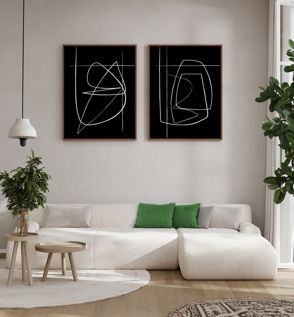 Transform your space with the INVERTED ABSTRACTION SET, SET OF 2 PAINTINGS featuring bold black-and-white designs.