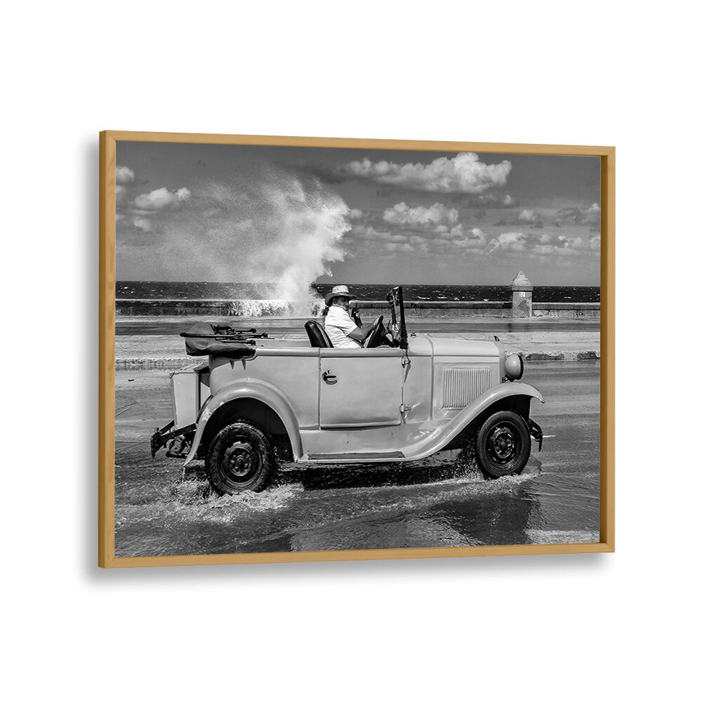 Classic car splashes through waves, capturing the spirit of urban life in MALECON, PHOTOGRAPHY PRINTS.