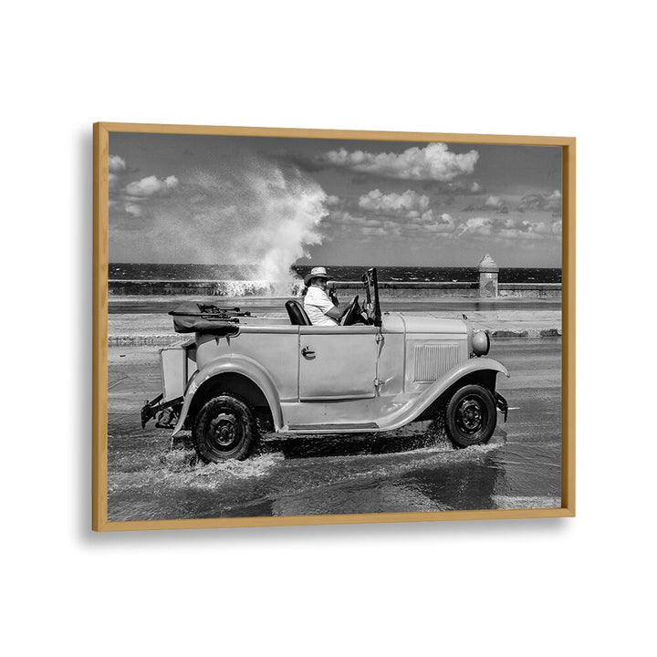 Classic car splashes through waves, capturing the spirit of urban life in MALECON, PHOTOGRAPHY PRINTS.