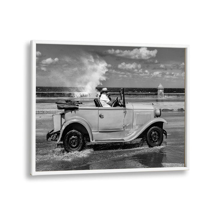Classic car splashes through waves in vibrant Malecon, capturing urban life in stunning MALECON, PHOTOGRAPHY PRINTS.
