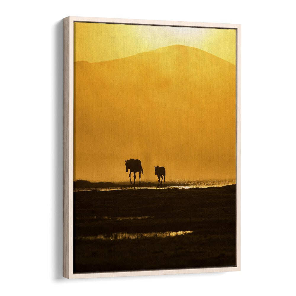 Fine art photography print "FOLLOWING MOMMY, PHOTOGRAPHY PRINTS" captures a tender moment between a mother and calf.