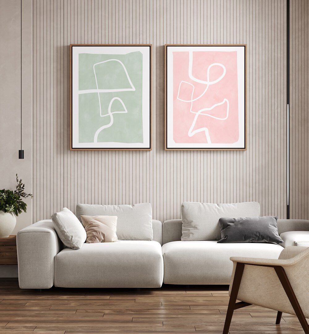 Elegant living room featuring PASTEL PATTERNS, SET OF 2 PAINTINGS with geometric designs and floral motifs.