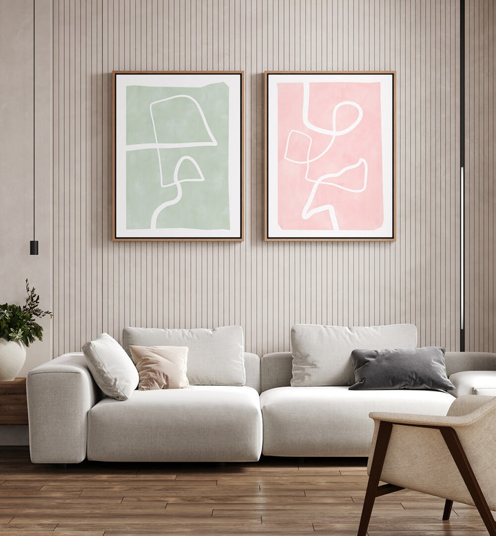 Elegant living room featuring PASTEL PATTERNS, SET OF 2 PAINTINGS with geometric designs and floral motifs.