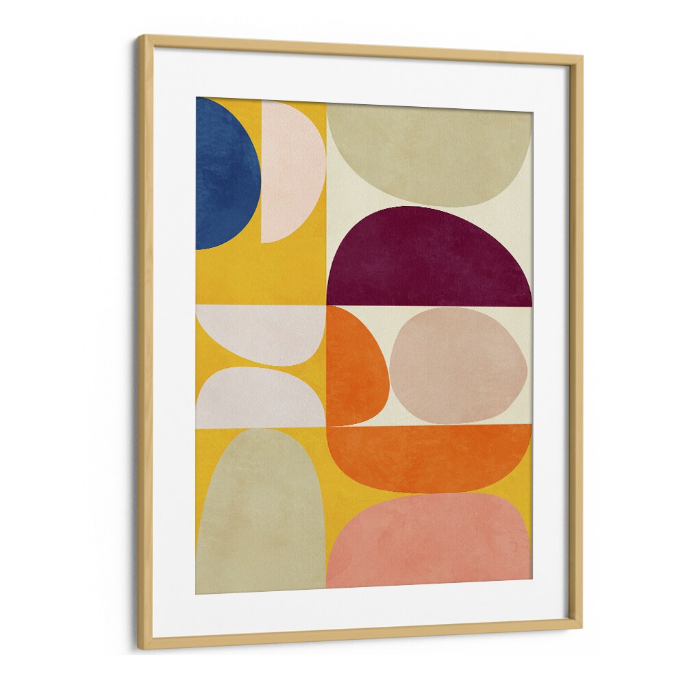 Colorful geometric design of VIVID BAUHAUS II, ABSTRACT PAINTINGS by Ana Rut Bre in a stylish oak frame.
