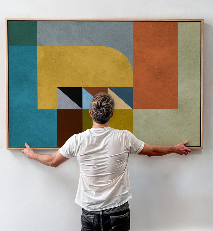 A person admires GEOMETRIC HARMONY II, GEOMETRIC ART PRINTS, enhancing any space with modern elegance.