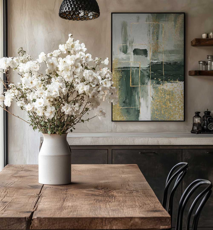 White flowers in a vase on a wooden table with abstract art in the background