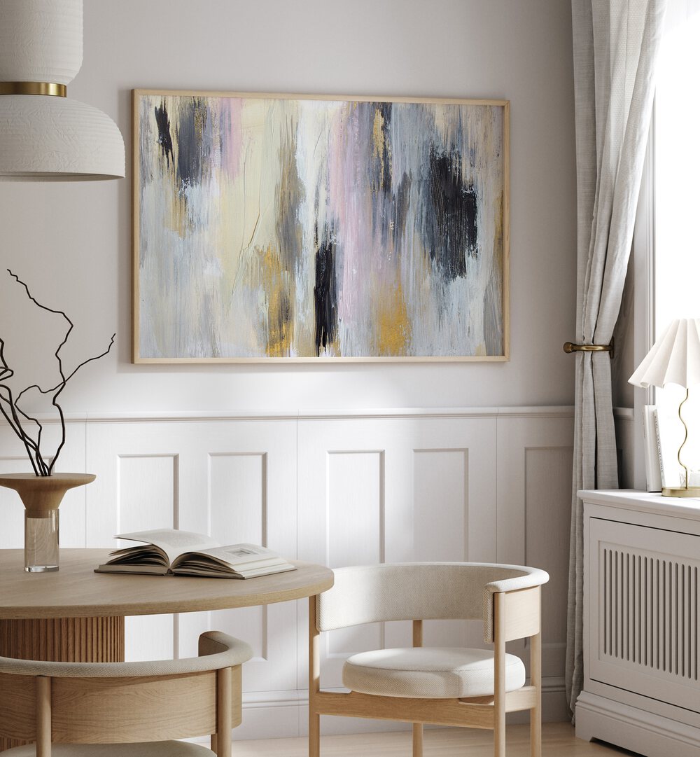 Elegant living space featuring POISED, ABSTRACT PAINTINGS above a wooden table, enhancing modern decor.