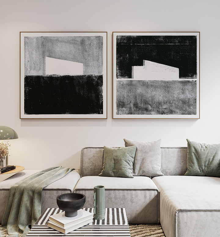 Modern living room with abstract art on the wall and a gray sofa.