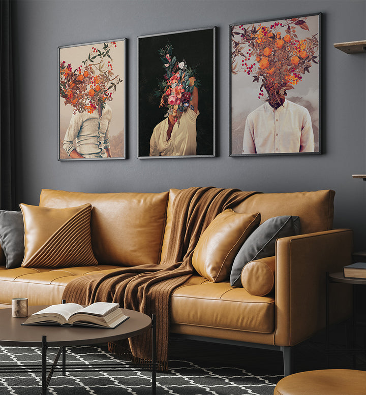 Brown leather sofa with decorative pillows and a coffee table in a living room setting with floral-themed wall art.