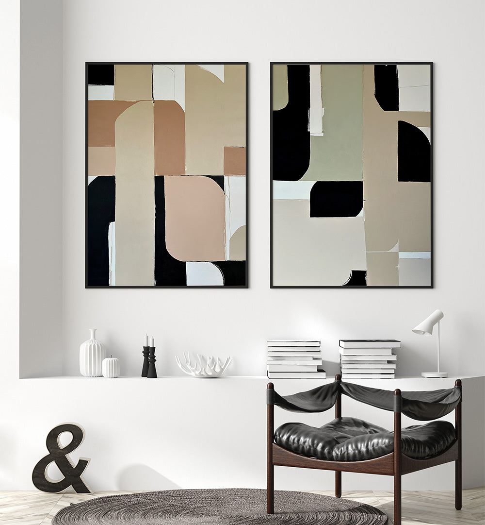Two abstract art pieces on a wall above a dining table with chairs.