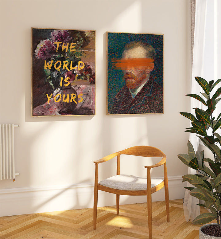 Room interior with two framed artworks on the wall, a wooden chair, and a plant.