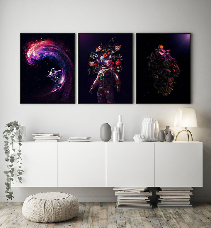 Three colorful abstract artworks on a wall above a white cabinet with decorative items.