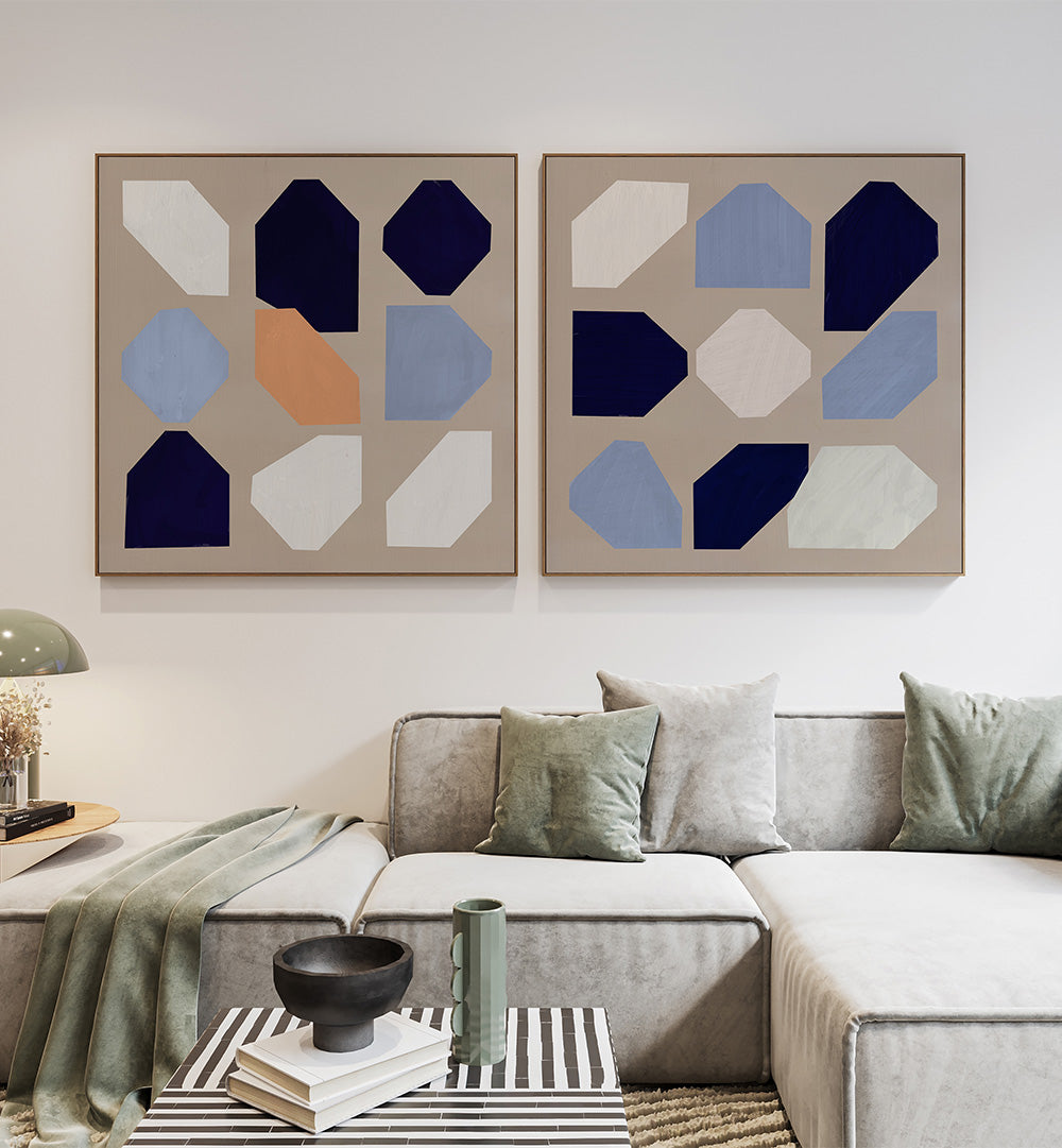 Modern living room with abstract wall art and a gray sofa.