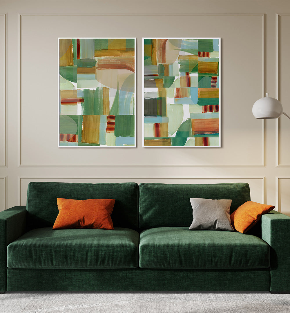 Two abstract paintings above a green sofa with colorful cushions in a living room setting.