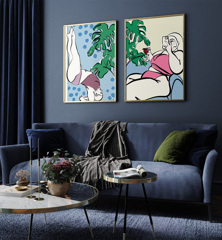 Living room with blue sofa, coffee table, and two abstract wall art pieces on a dark blue wall.