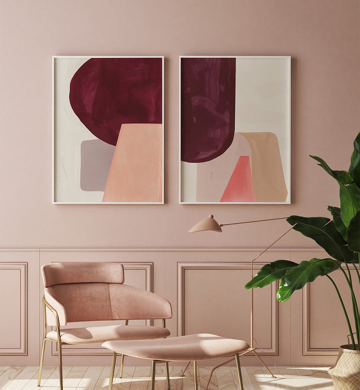 Modern interior with abstract art on a pink wall, chair, and plant.