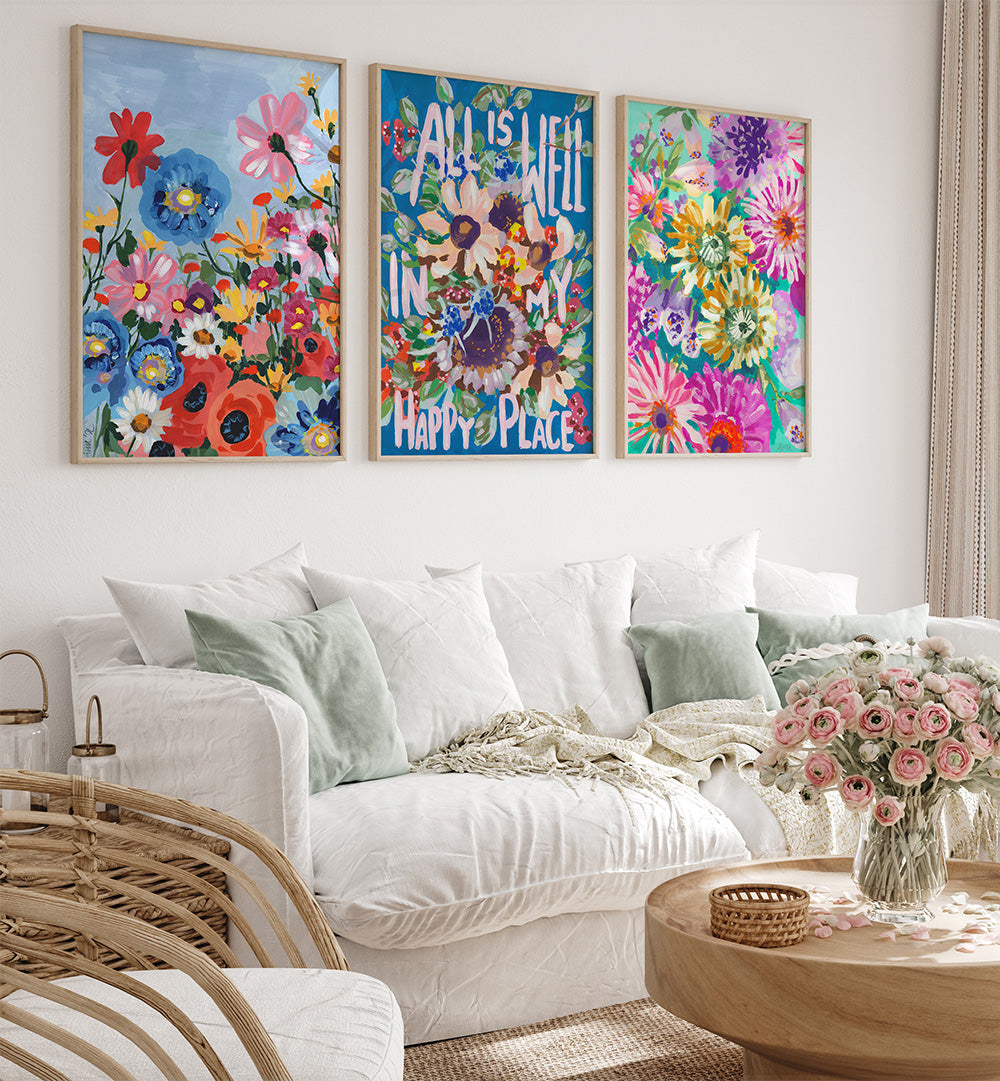 Living room with floral wall art and a white sofa