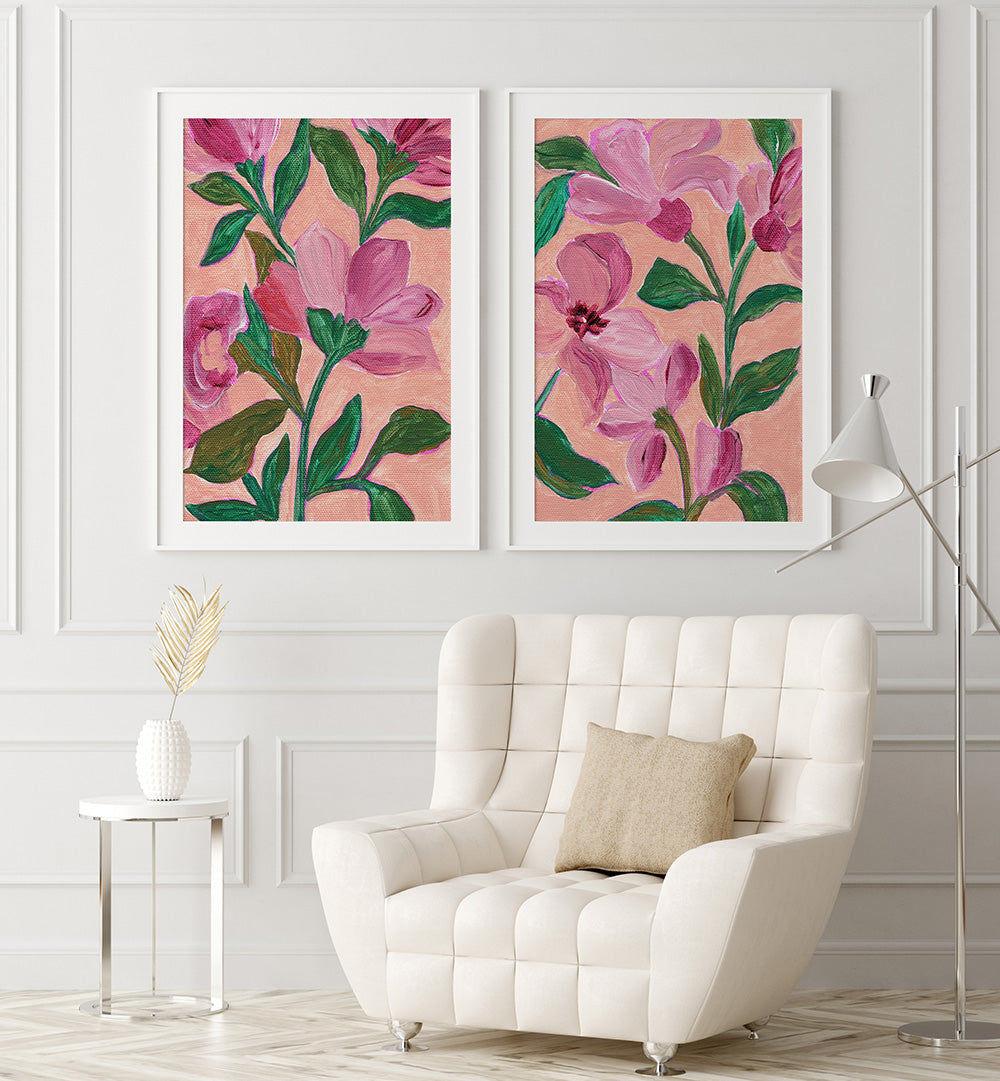 Floral artwork on a wall above a white armchair with a beige pillow.