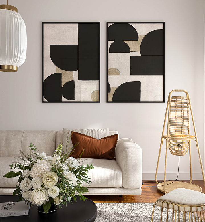 Modern living room with abstract art, white sofa, and decorative elements.