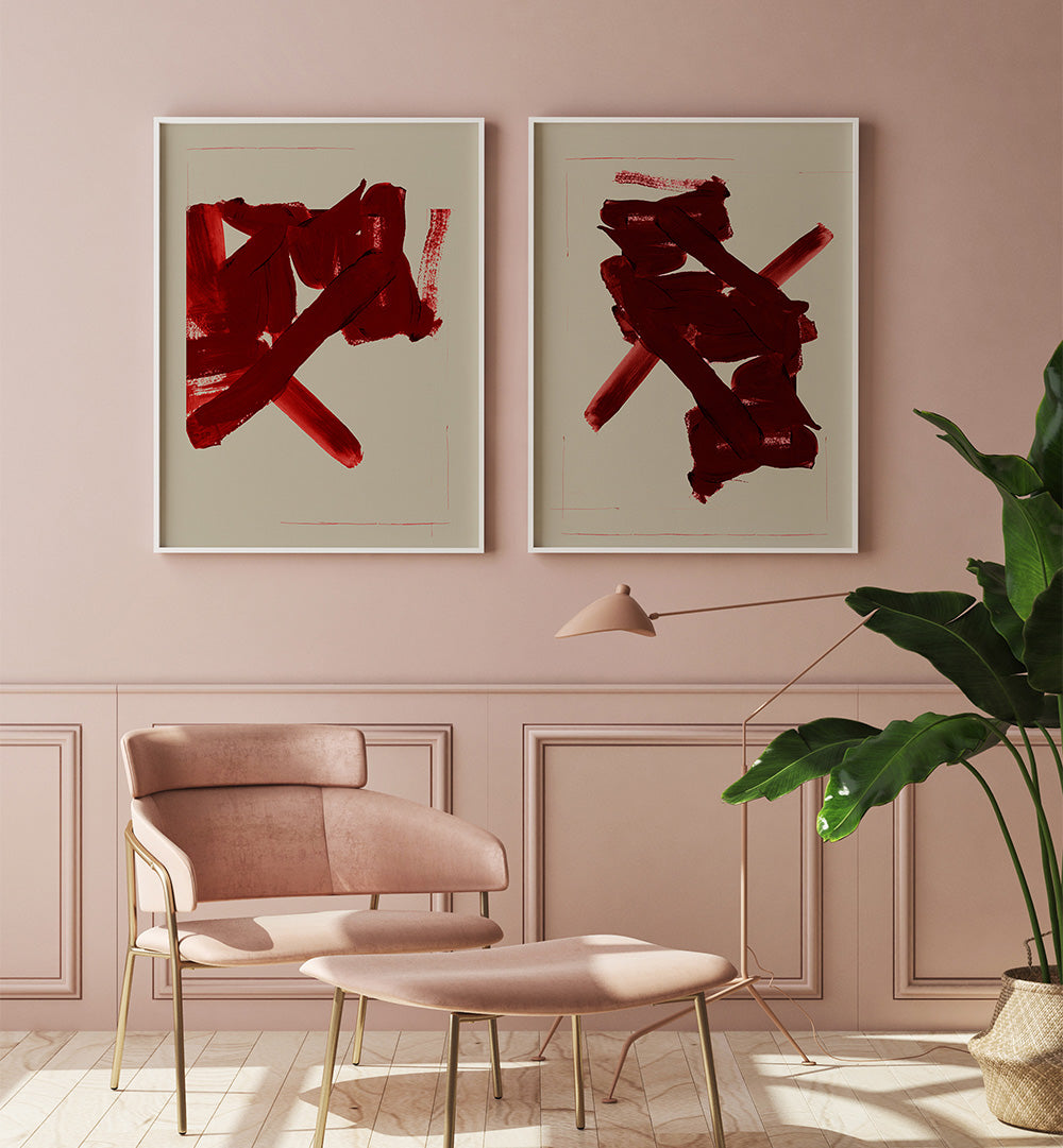 Modern interior with abstract red artworks on a pink wall, a chair, and a plant.