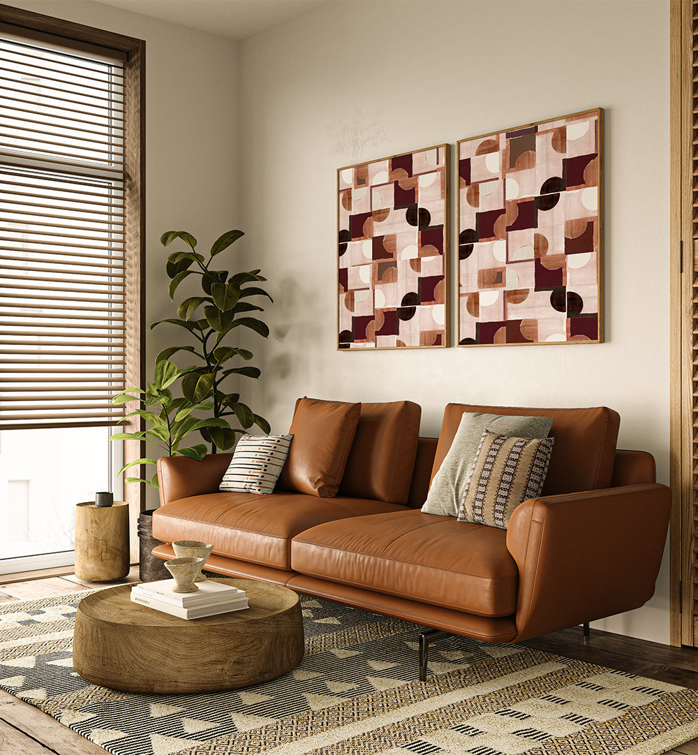 Living room with a brown leather sofa, wooden coffee table, and abstract wall art.