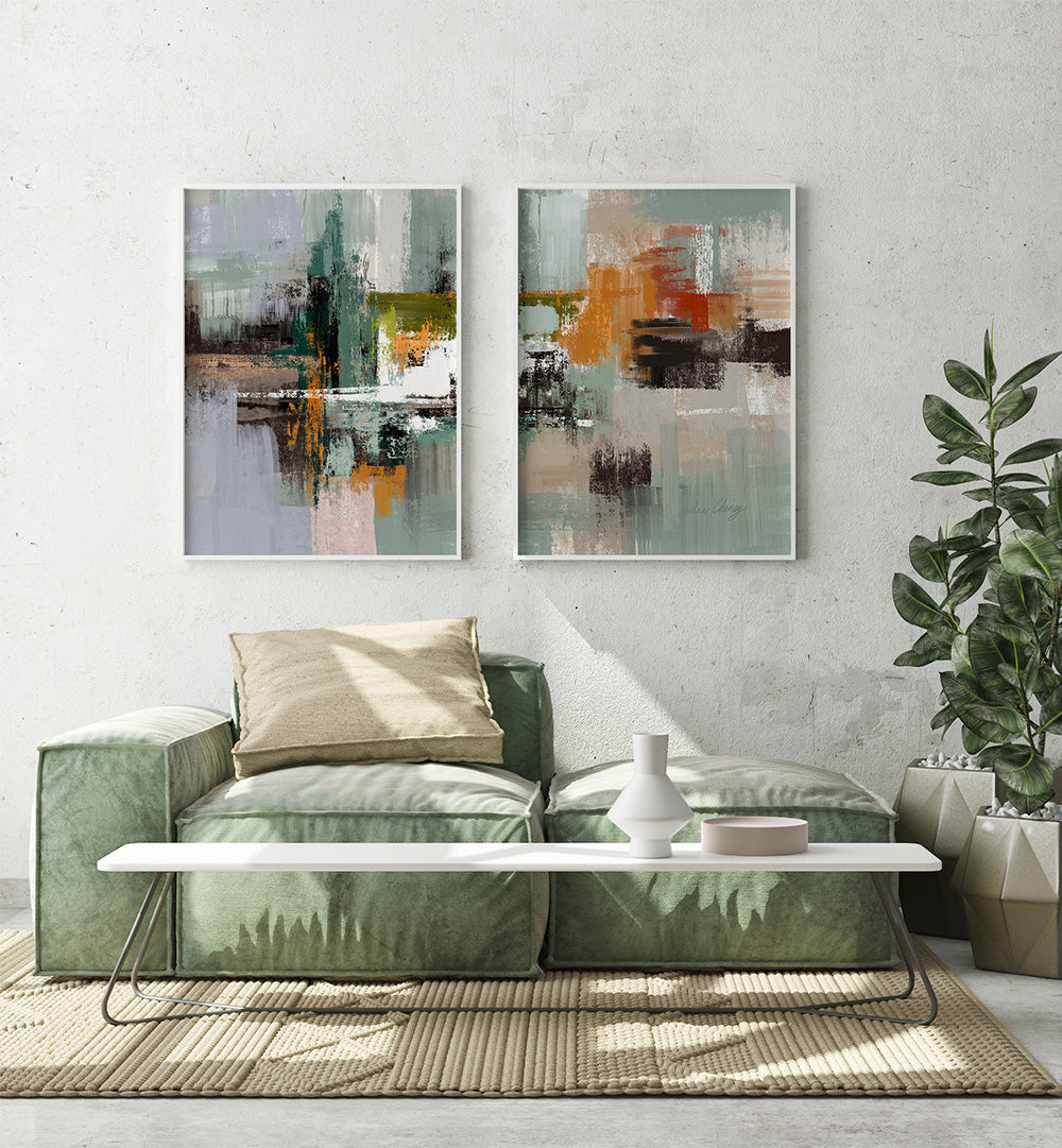 Living room with abstract art on the wall, green sofa, and white coffee table.