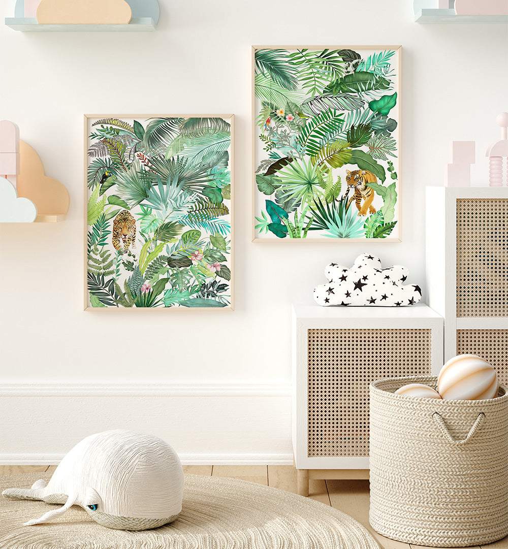 Two framed tropical leaf prints on a wall with a child's room setting.