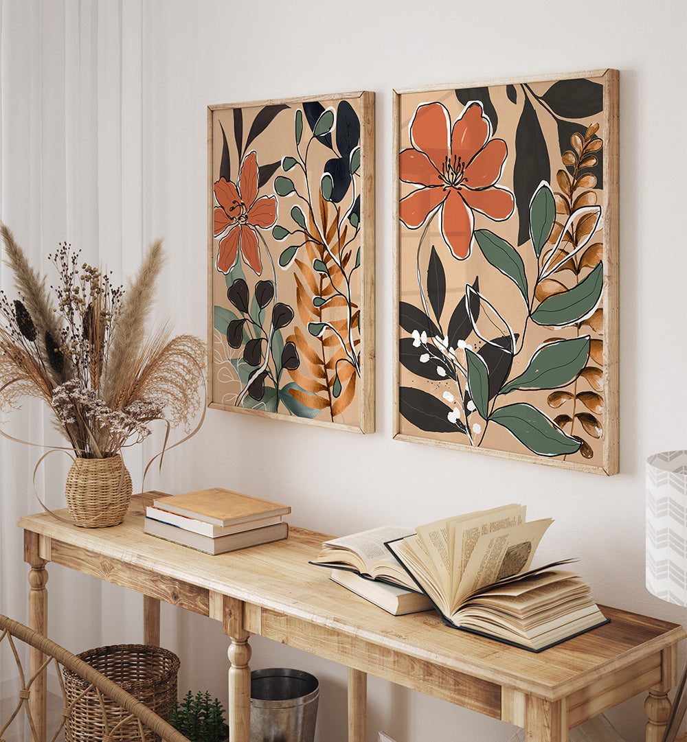 Floral wall art above a wooden console table with books and a vase.