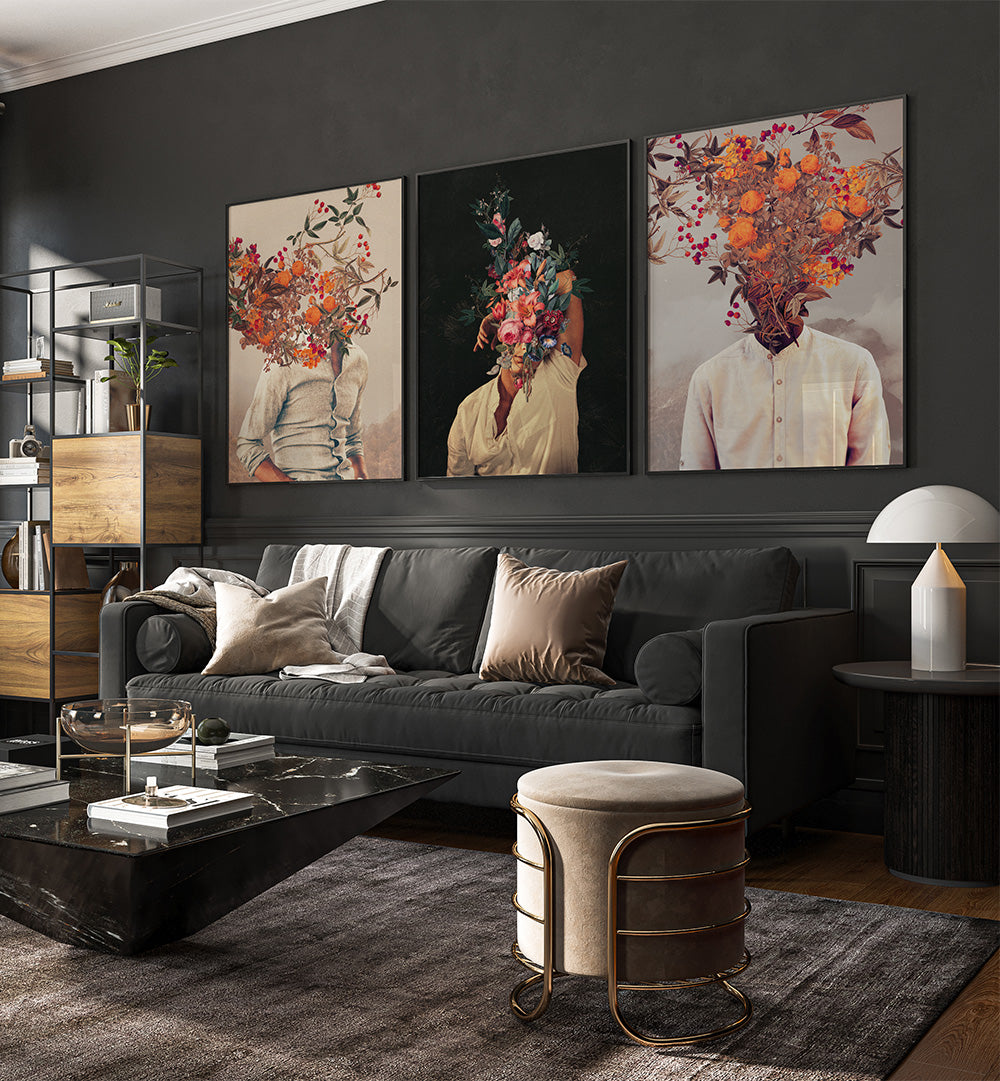 Modern living room with a dark gray sofa, decorative cushions, and wall art featuring floral heads.