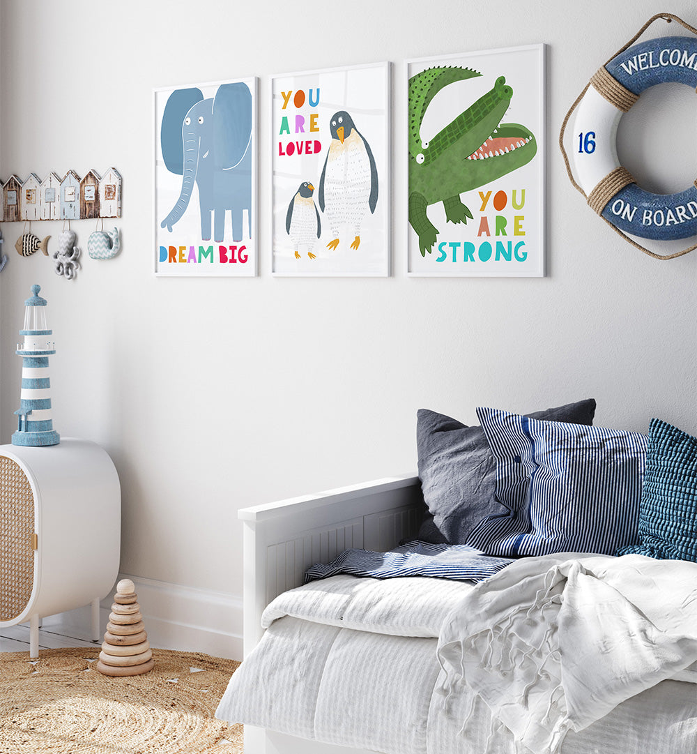 Children's bedroom with motivational posters on the wall, a bed with pillows, and decorative items.