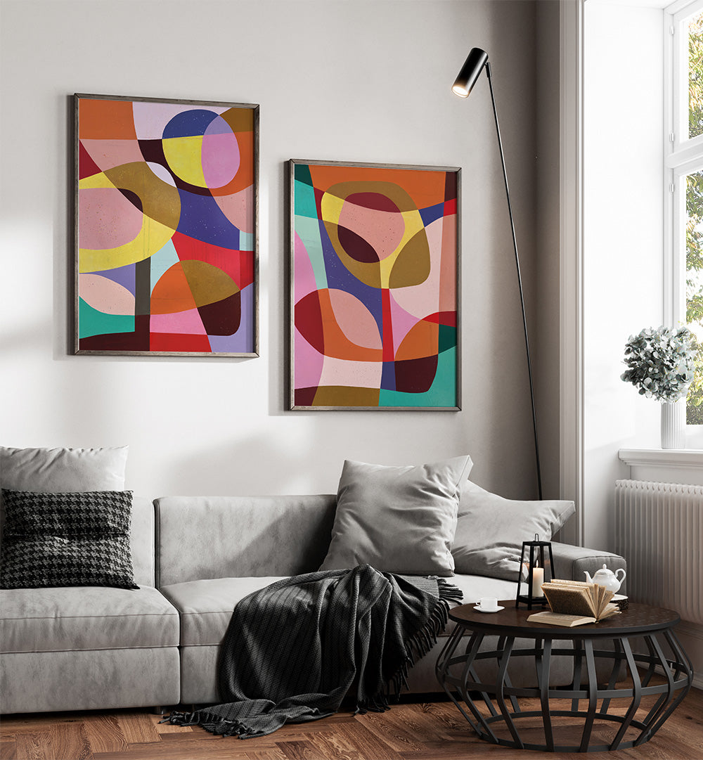 Living room with abstract art on the wall, a gray sofa, and a coffee table.