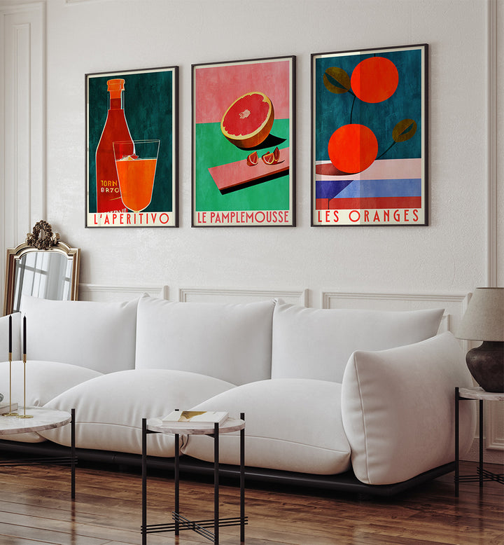 Modern living room with a white sofa and colorful wall art depicting fruits and drinks.