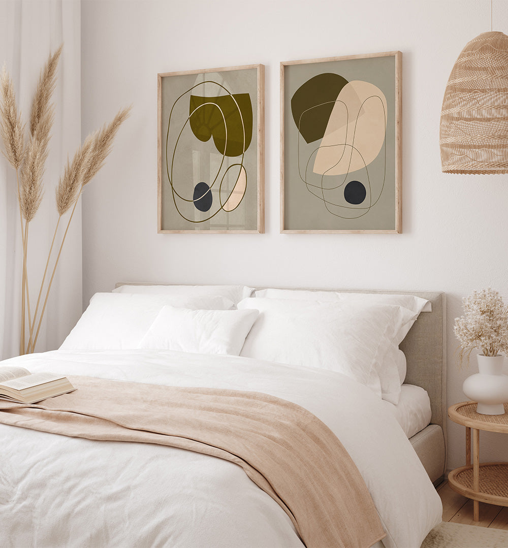 Neatly made bed with abstract art on the wall in a bedroom setting.