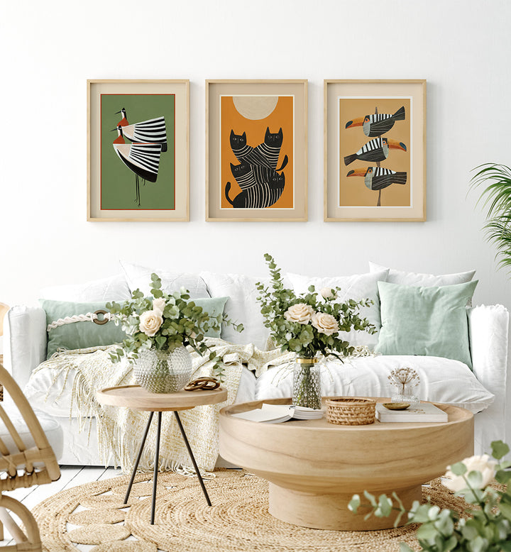 Living room with a white sofa, wooden coffee table, and decorative wall art.