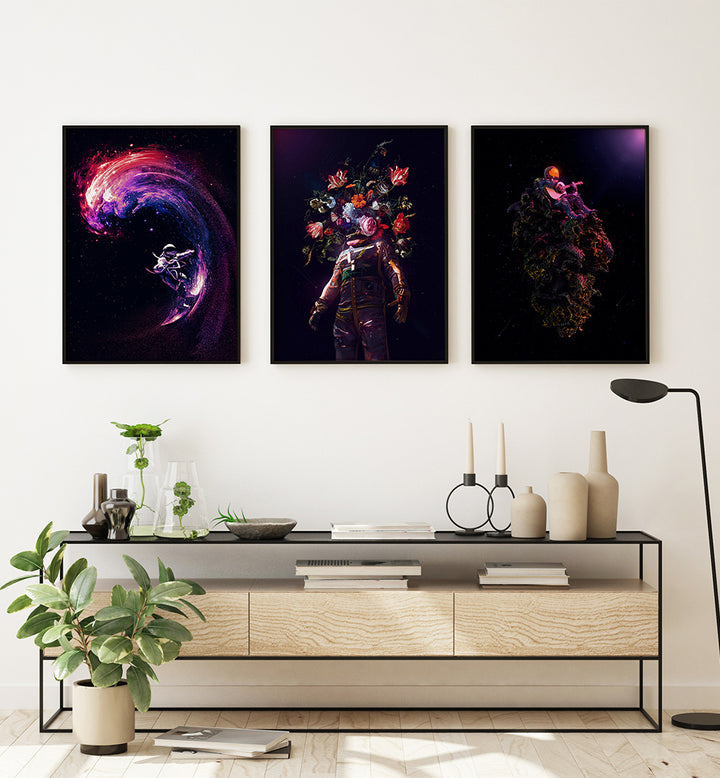Three abstract art prints on a wall above a modern console table.