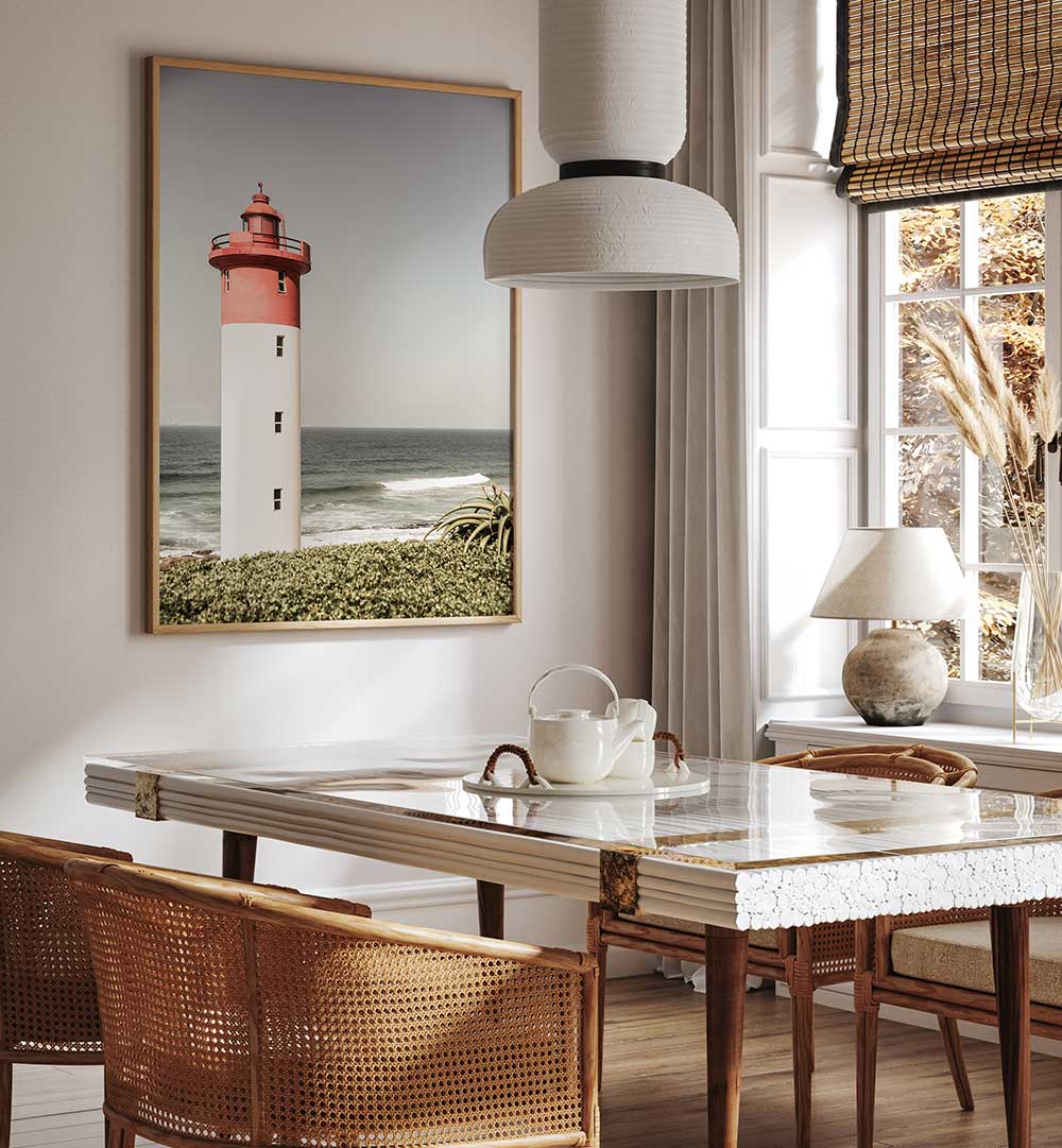 Lighthouse wall art over dining table in coastal interior — BEACON BY THE SEA , BEACH PAINTINGS