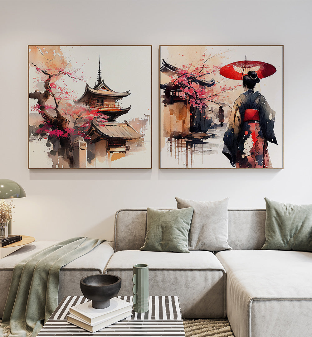 Living room with two framed artworks on the wall, a gray sofa with decorative pillows, and a coffee table.
