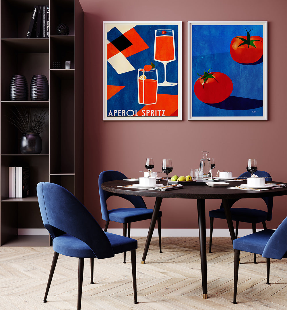 Dining room with a table set for four, blue chairs, and two framed artworks on the wall.