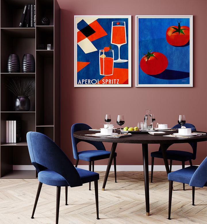 Dining room with a table set for four, blue chairs, and two framed artworks on the wall.