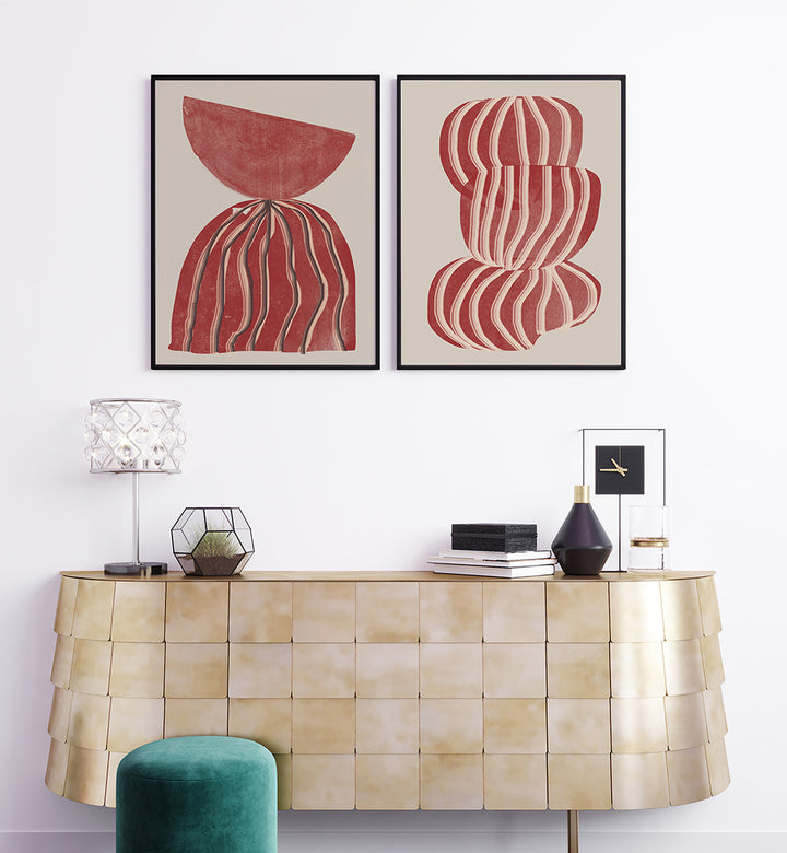 Decorative console table with abstract wall art and a lamp.