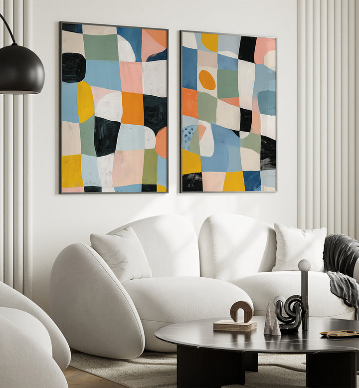 Modern living room with abstract art on the wall and a white sofa.