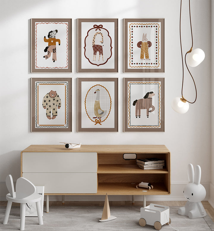 Children's room with wooden furniture, toys, and framed animal prints on the wall.